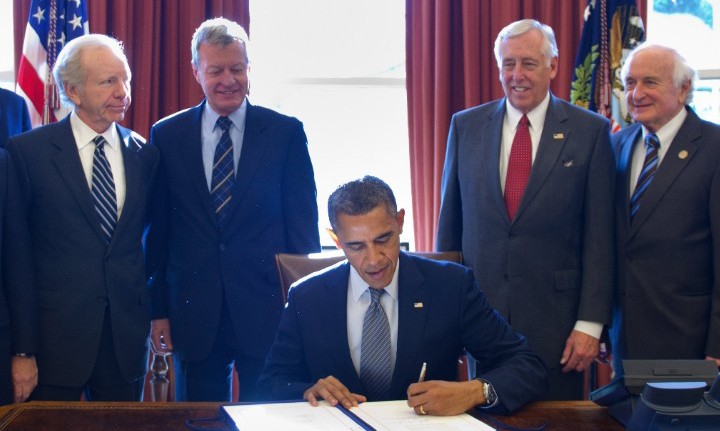President Obama signs the original Magnitsky Act 
